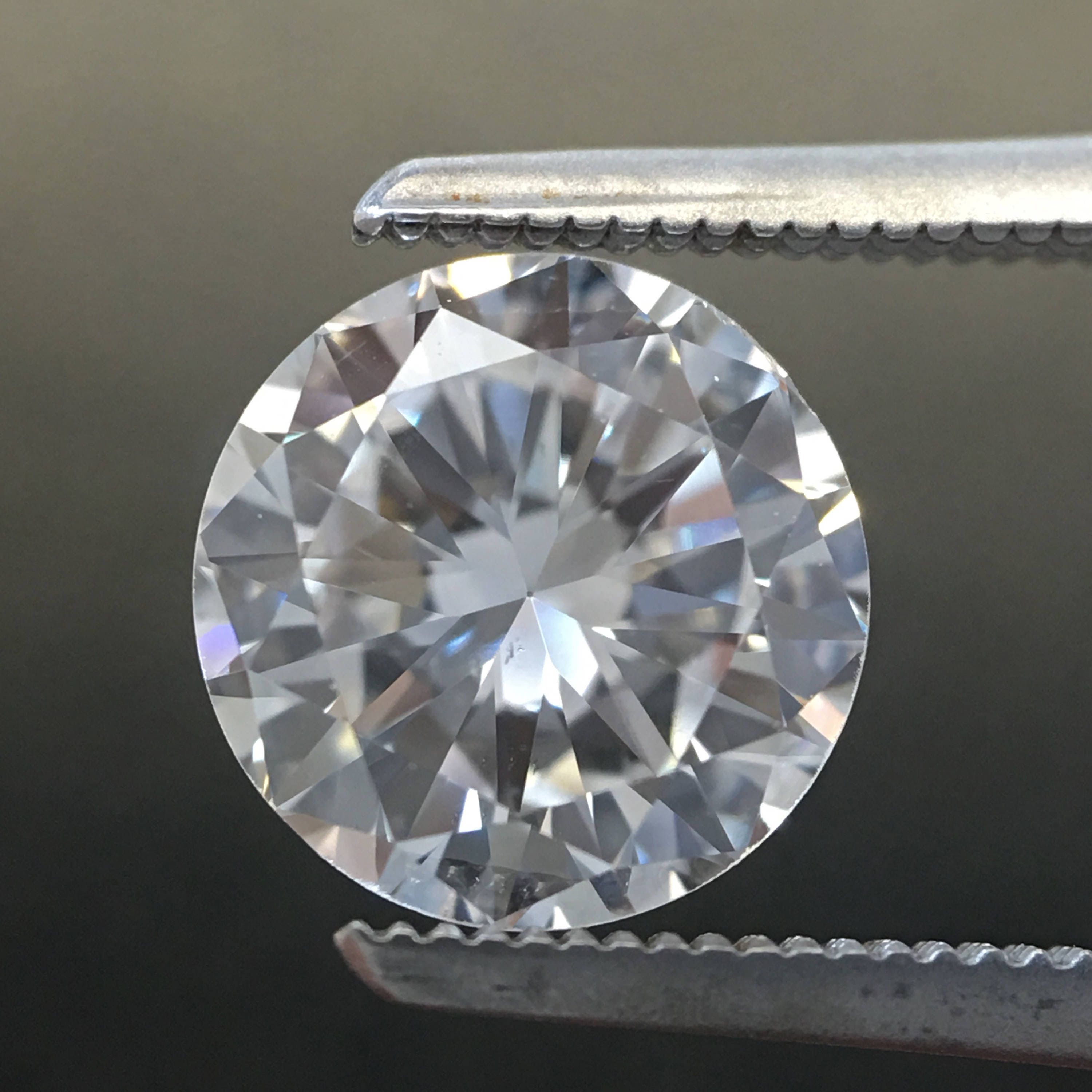 GIA Certified 0.88 CTW round brilliant diamond loose stone in E color, SI1 clarity, from Black Market LLC.