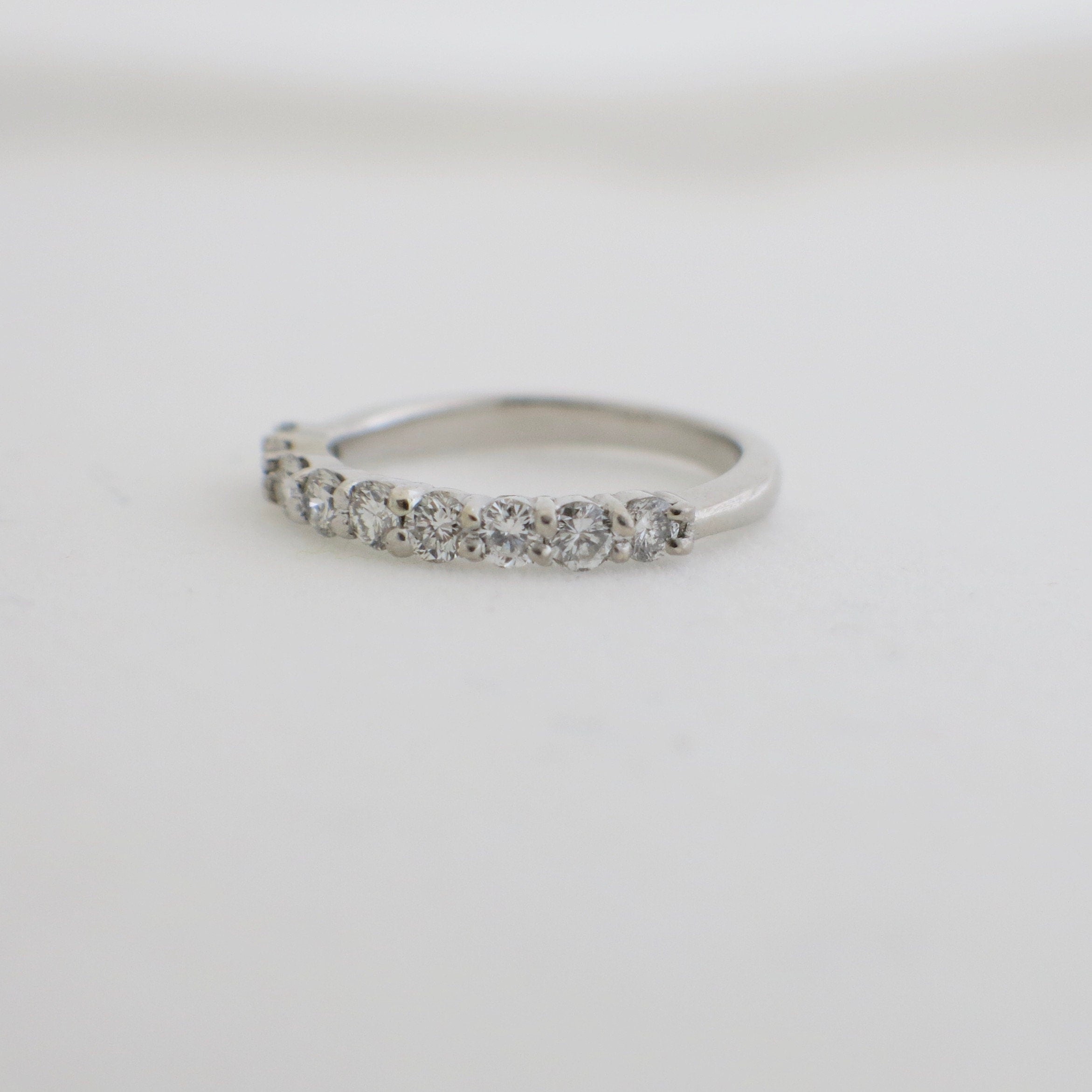 14K white gold 9-stone diamond wedding band with shared prongs, stackable ring, .45 CTW, size 4.5, from Black Market LLC.