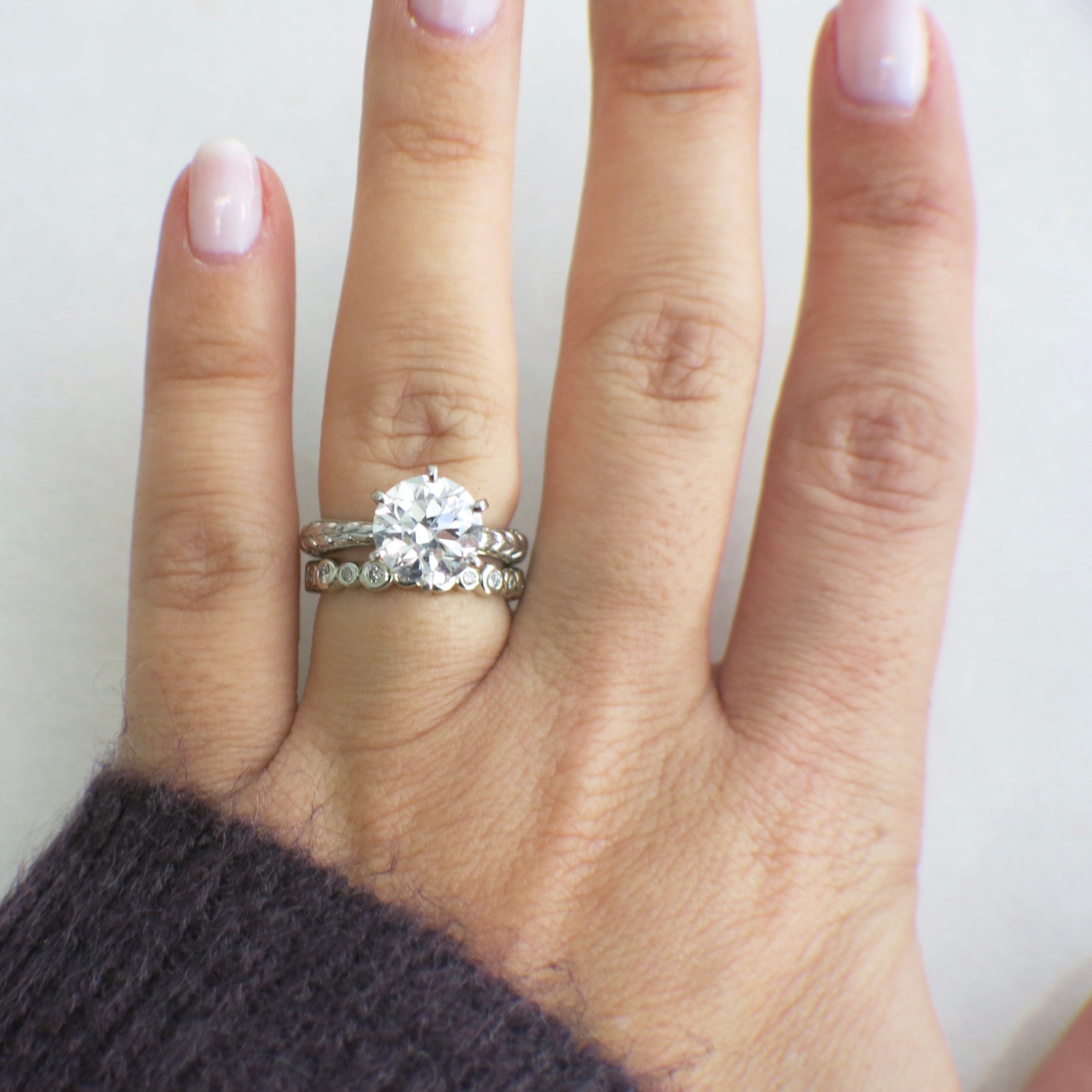 14K white gold diamond bezel eternity band, stackable wedding ring with sparkling diamonds, size 5.5, by Black Market LLC.