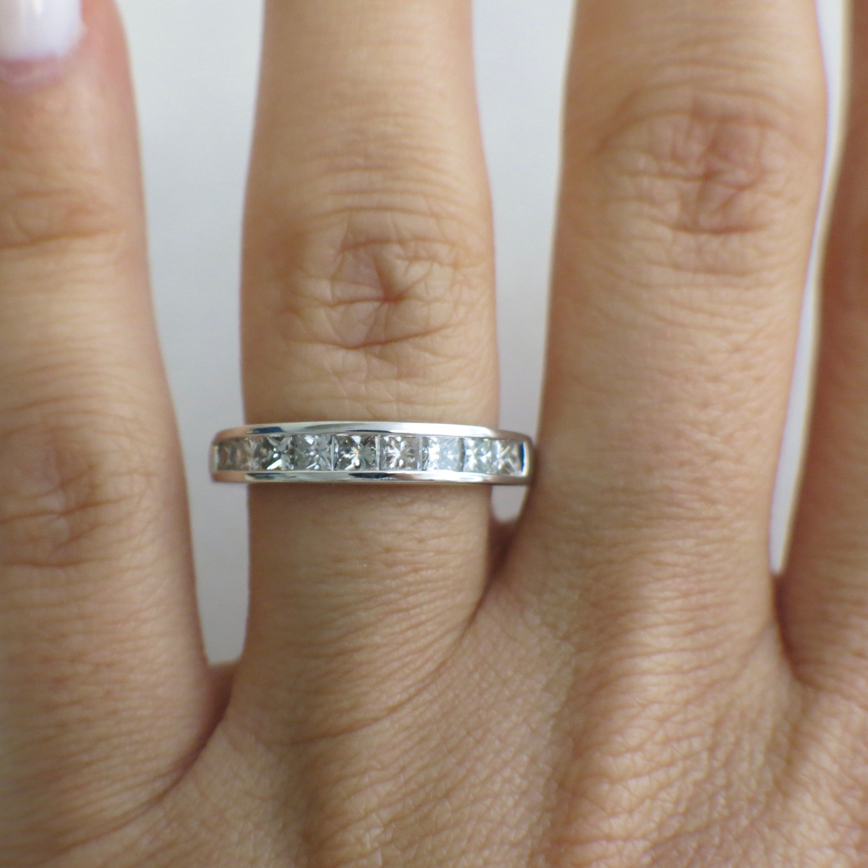 14K white gold princess cut diamond band with channel set diamonds, .90 CTW, size 6.75 wedding ring from Black Market LLC.