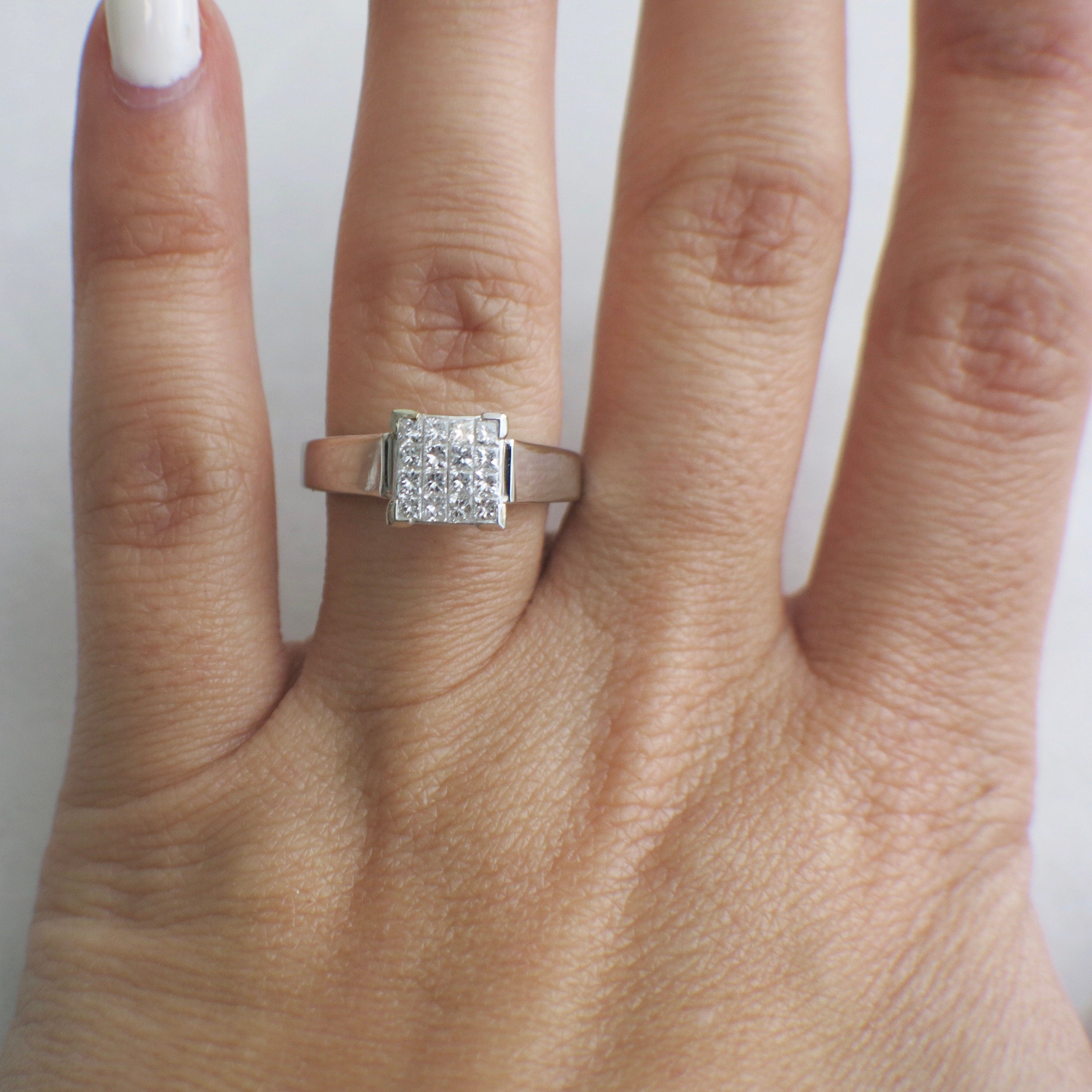 14K white gold princess cut diamond cluster ring with invisible setting, showcasing 0.50 carats total weight and intricate design.