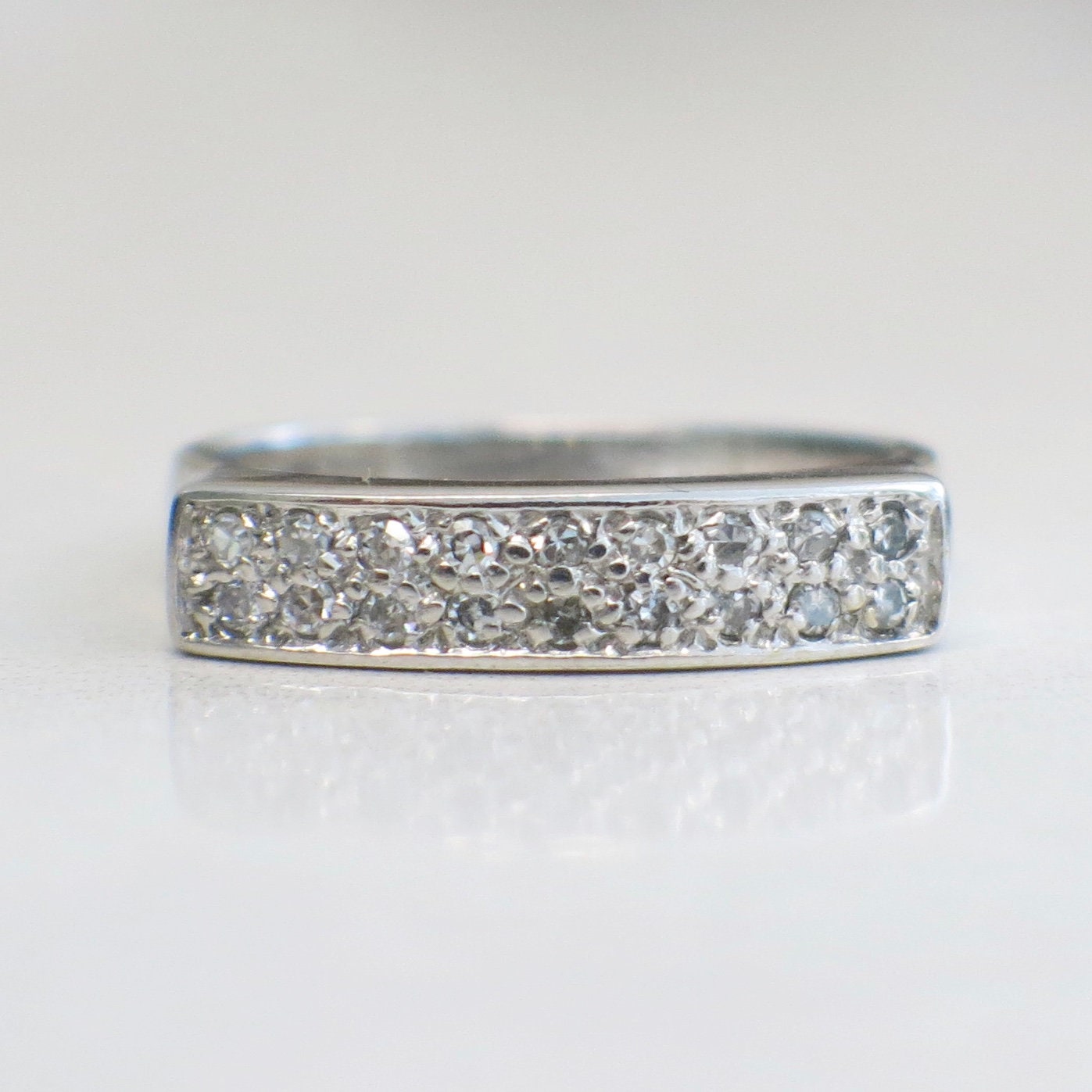 Vintage 14K white gold diamond bar ring from Black Market LLC featuring 0.27 CTW, stackable flat band, size 6.75.