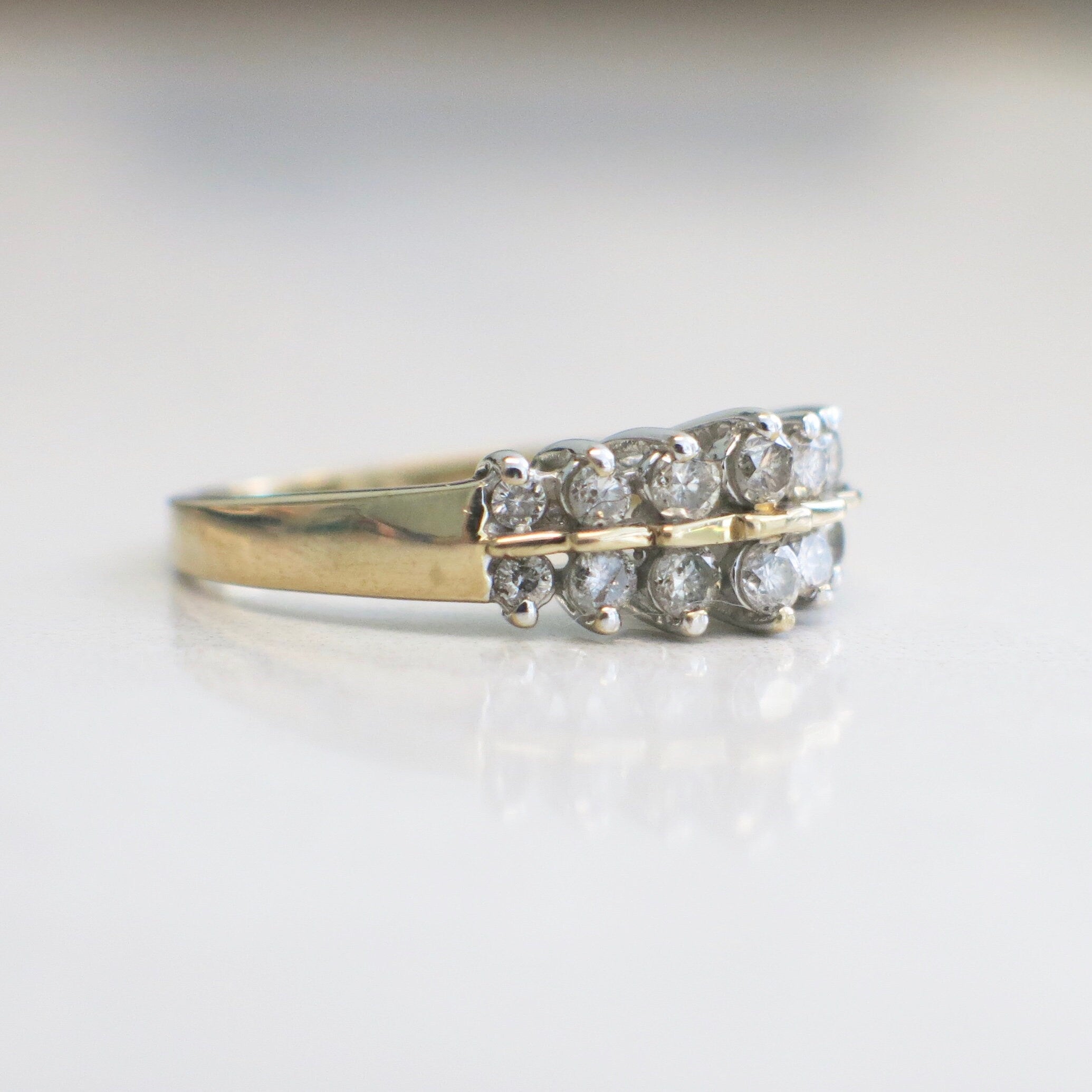 Vintage 14K yellow gold diamond double row ring with graduated band and .36 CTW, size 6.5, by Black Market LLC.