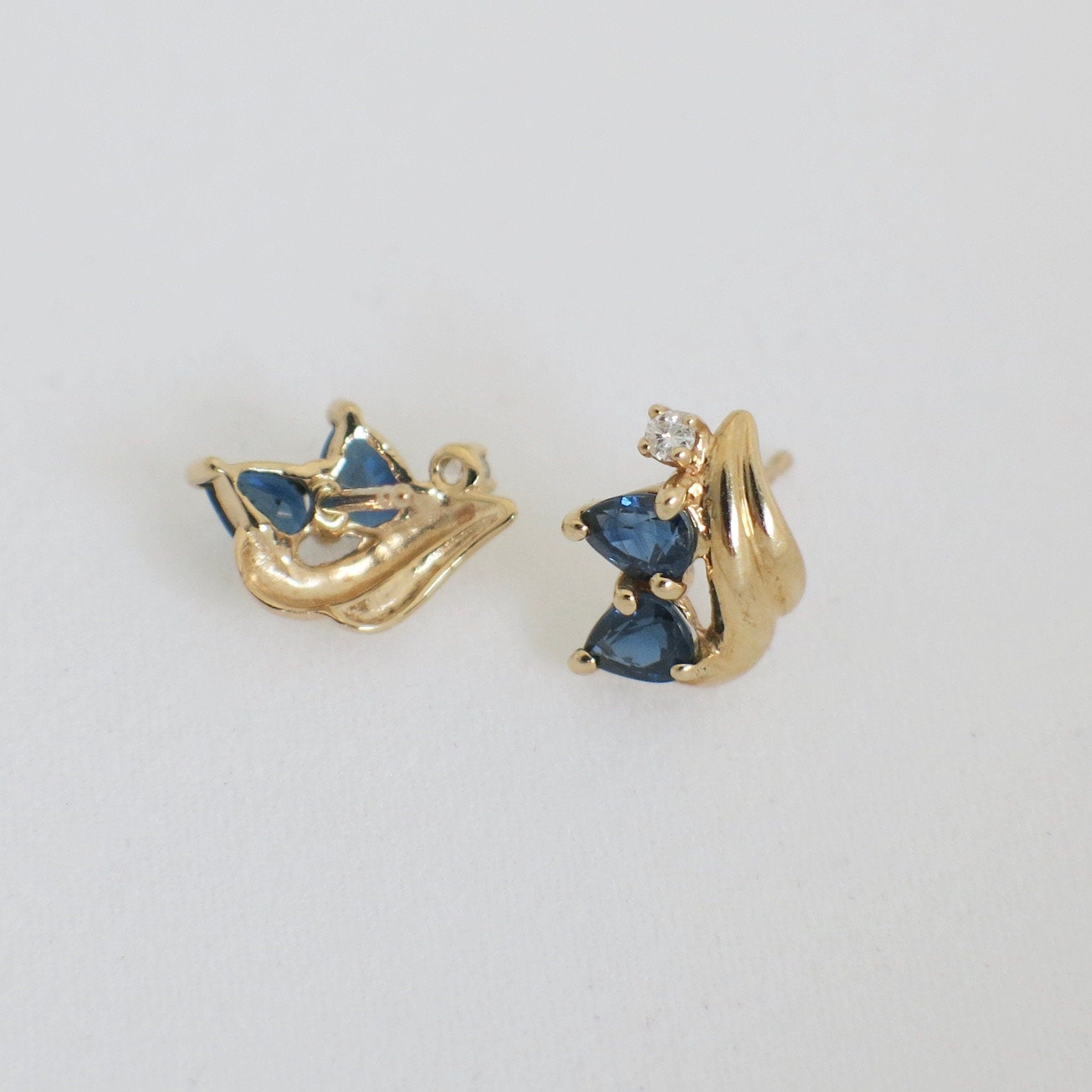 Vintage 14K gold sapphire and diamond earrings with yellow gold studs, featuring intricate design and sparkling gemstones.