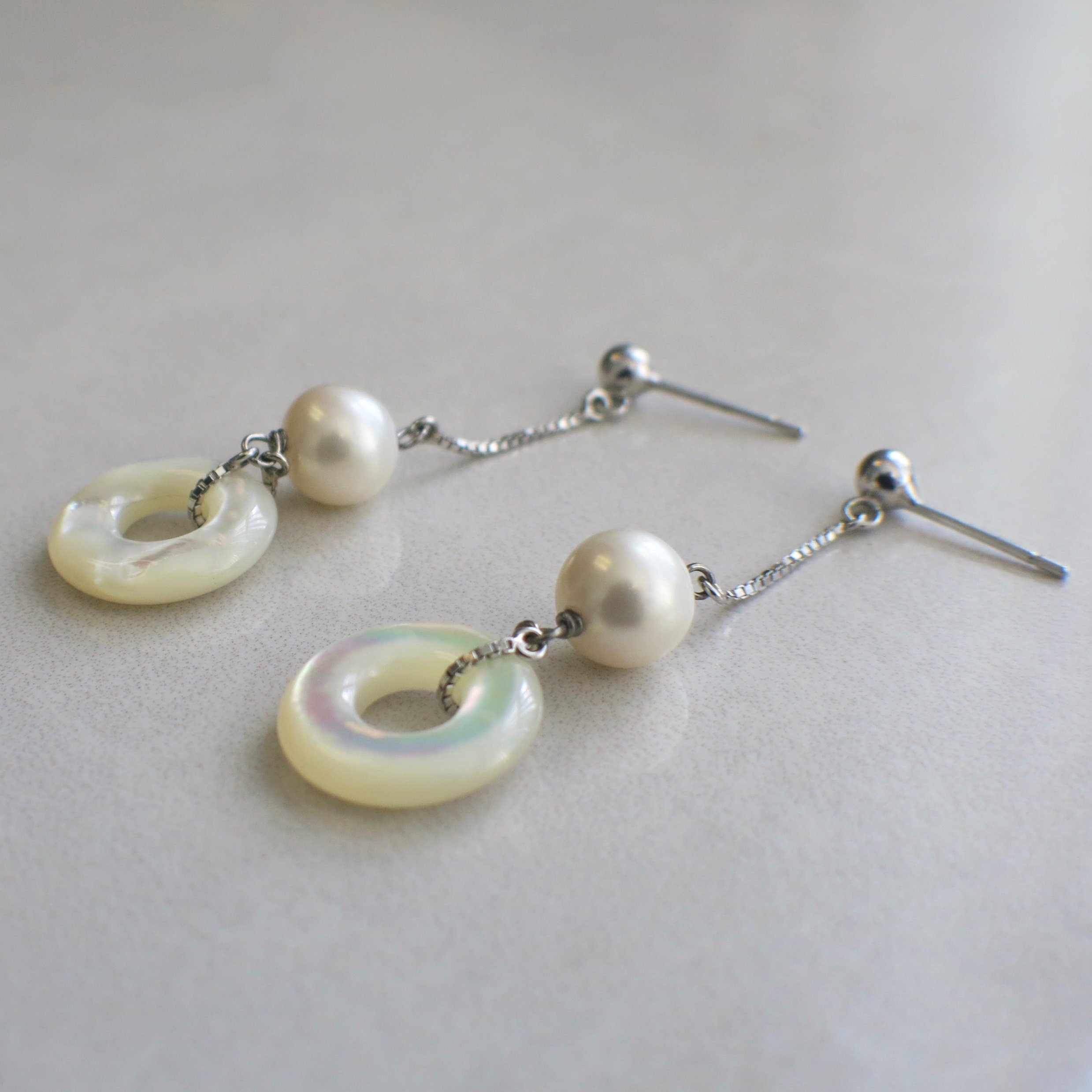 18K white gold pearl and mother of pearl dangle earrings with long drop chain, featuring elegant jewelry design by Black Market LLC