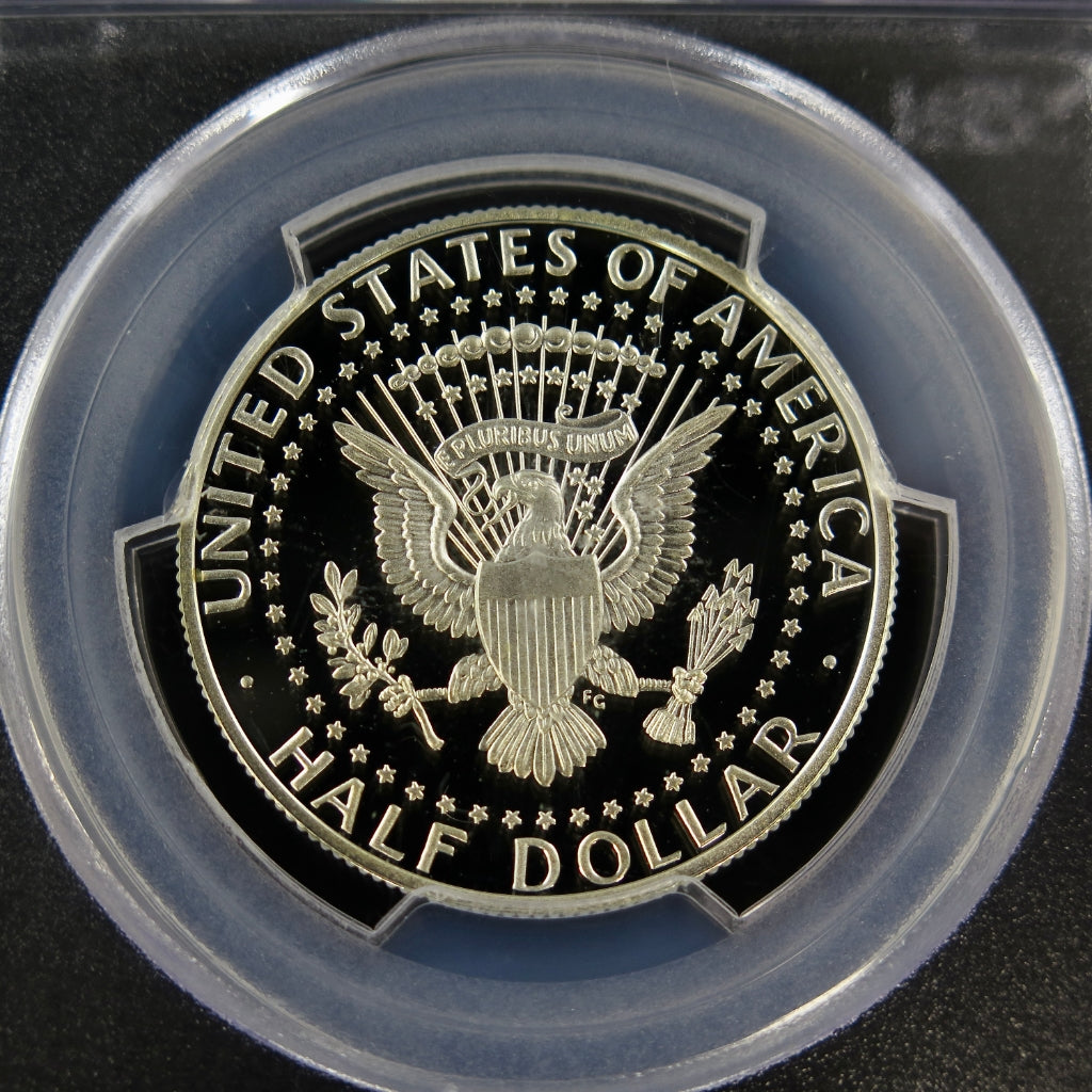 2014-P Kennedy Half Dollar PCGS PR70DCAM silver proof coin, 50th Anniversary issue, showcasing detailed design and reflective surface.