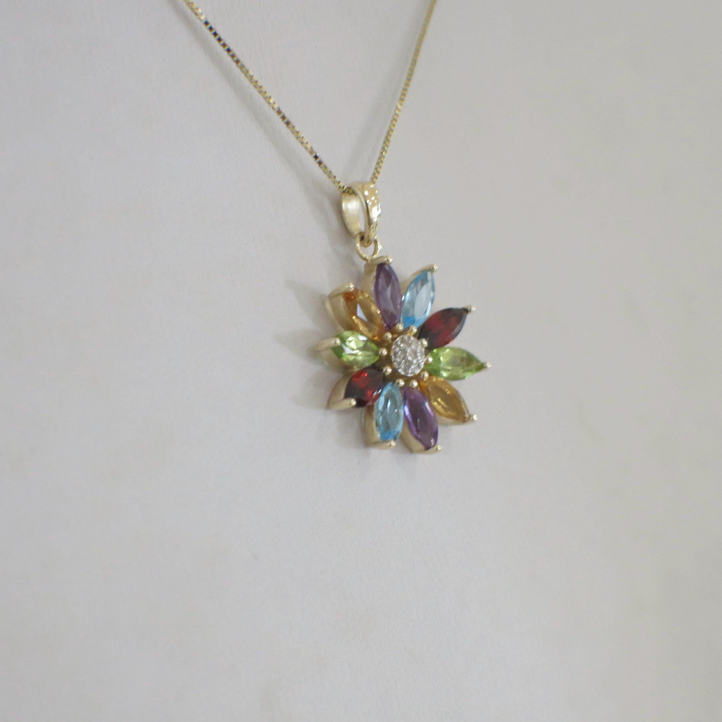 14K yellow gold multi-gemstone and diamond flower necklace featuring amethyst, peridot, citrine, topaz, and garnet.