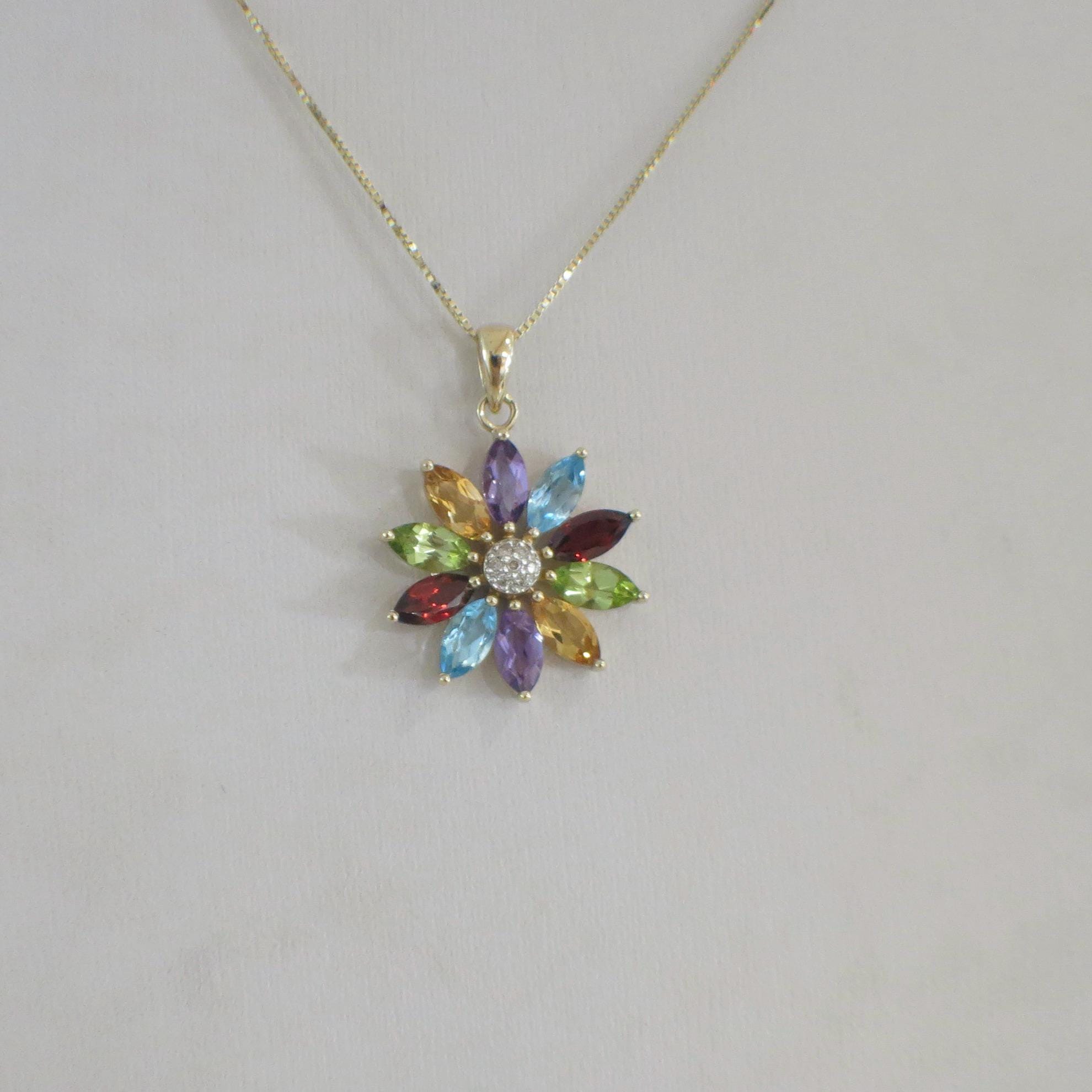 14K yellow gold multi-gemstone and diamond flower necklace featuring amethyst, peridot, citrine, topaz, and garnet gemstones.