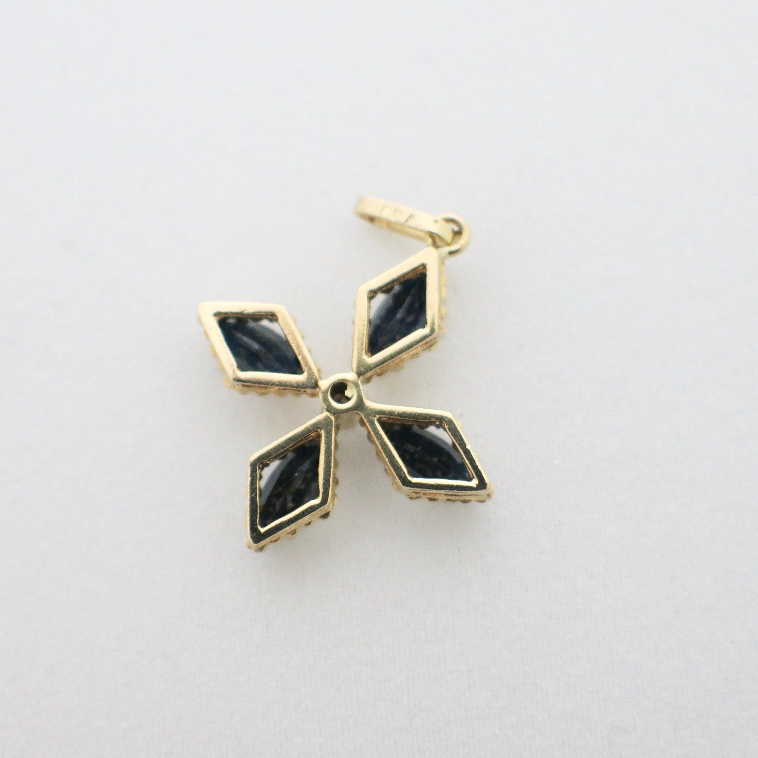 18K yellow gold sapphire cross pendant necklace with vintage floral design, marquise sapphires, and diamond center.