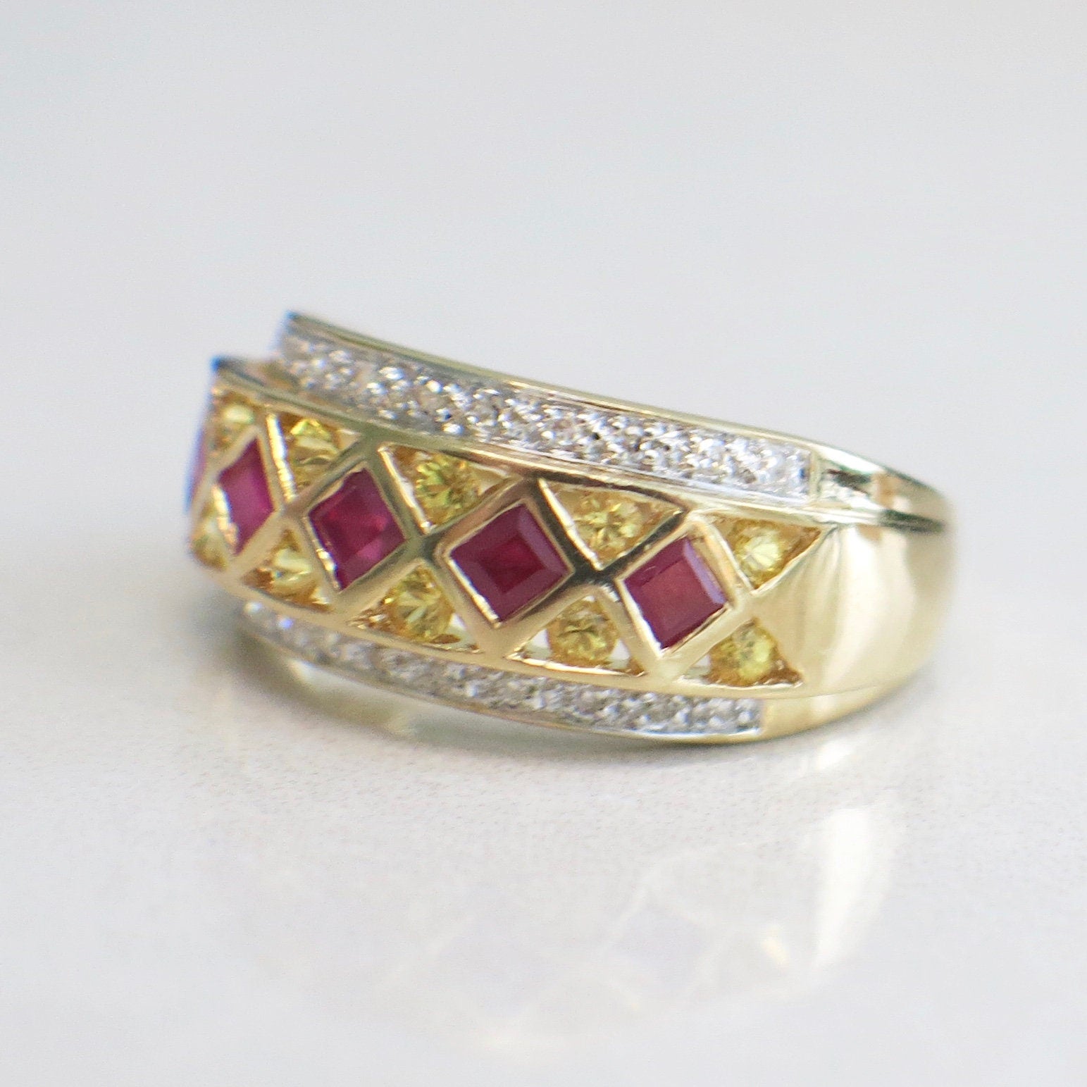 14K yellow gold pendant featuring ruby, citrine, and diamond stones in princess and round cut, size 6.