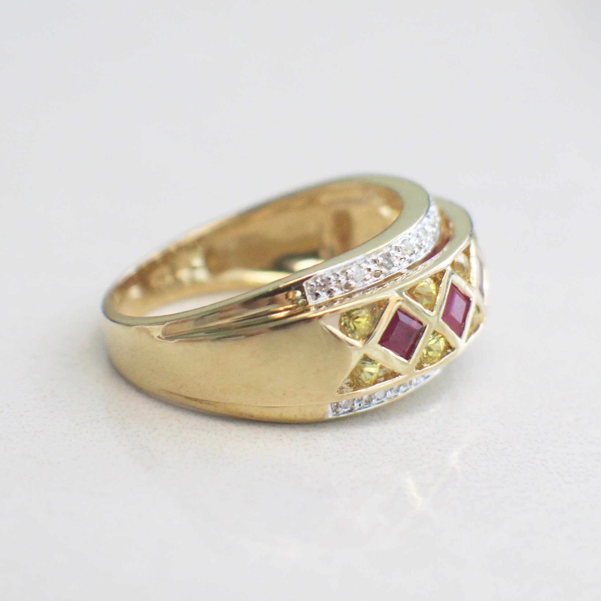 14K yellow gold pendant with ruby, citrine, and diamond accents featuring princess and round cut stones, size 6.