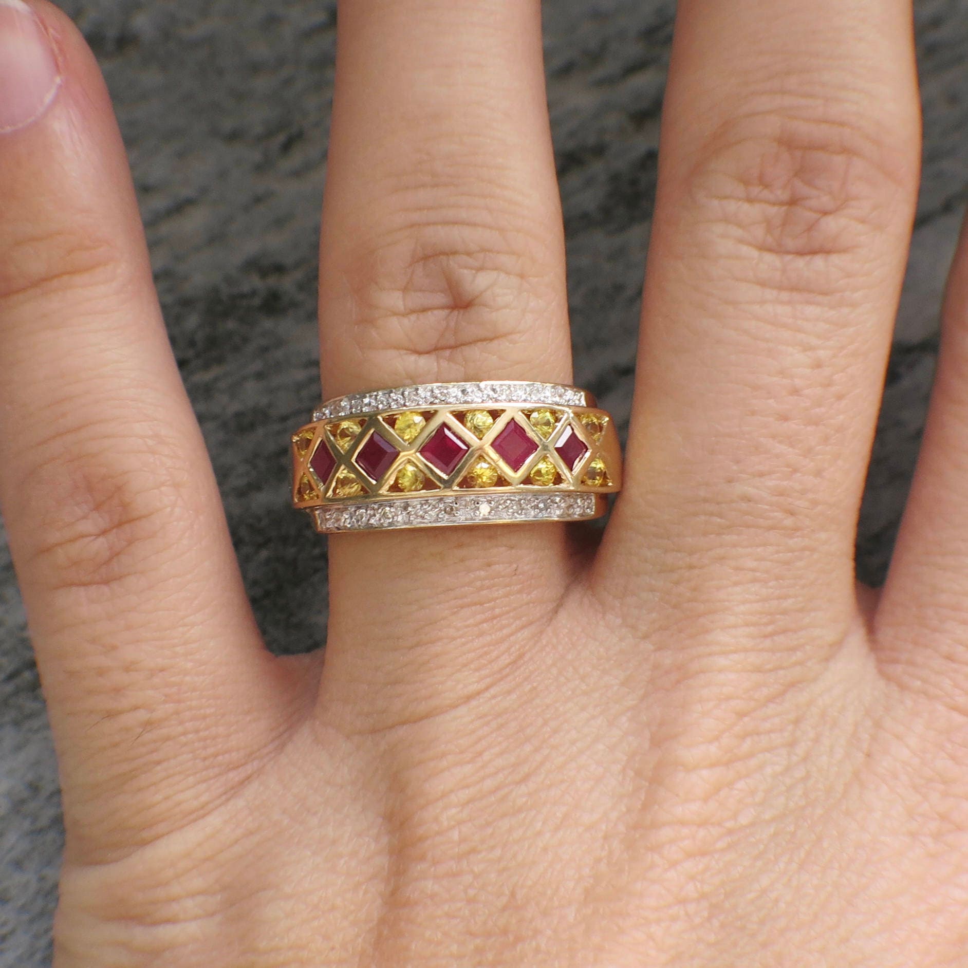 14K yellow gold pendant featuring ruby, citrine, and diamond stones in princess and round cuts, size 6, by Black Market LLC.
