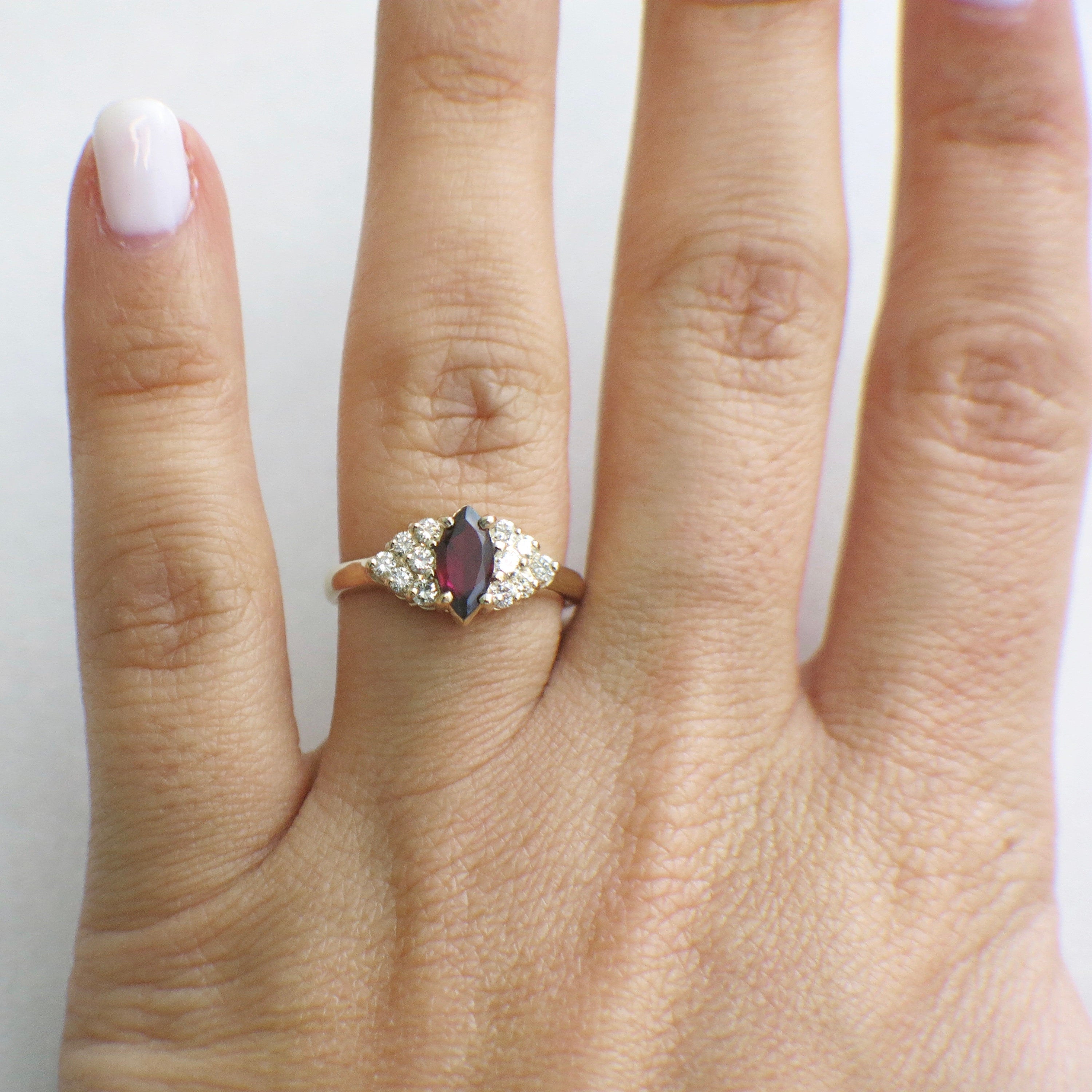 14K gold marquise garnet ring with diamond clusters, vintage style, size 6.5, featuring intricate detailing and elegant design.