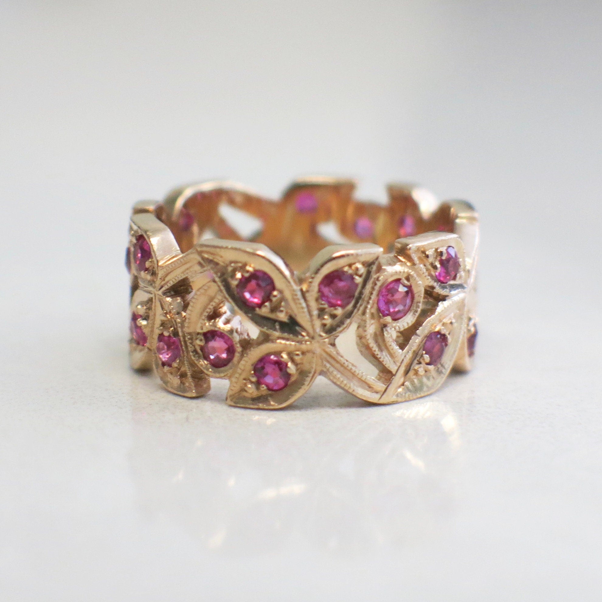 14K rose gold leaf band ring with pink sapphires, floral milgrain design, size 6.5, by Black Market LLC.