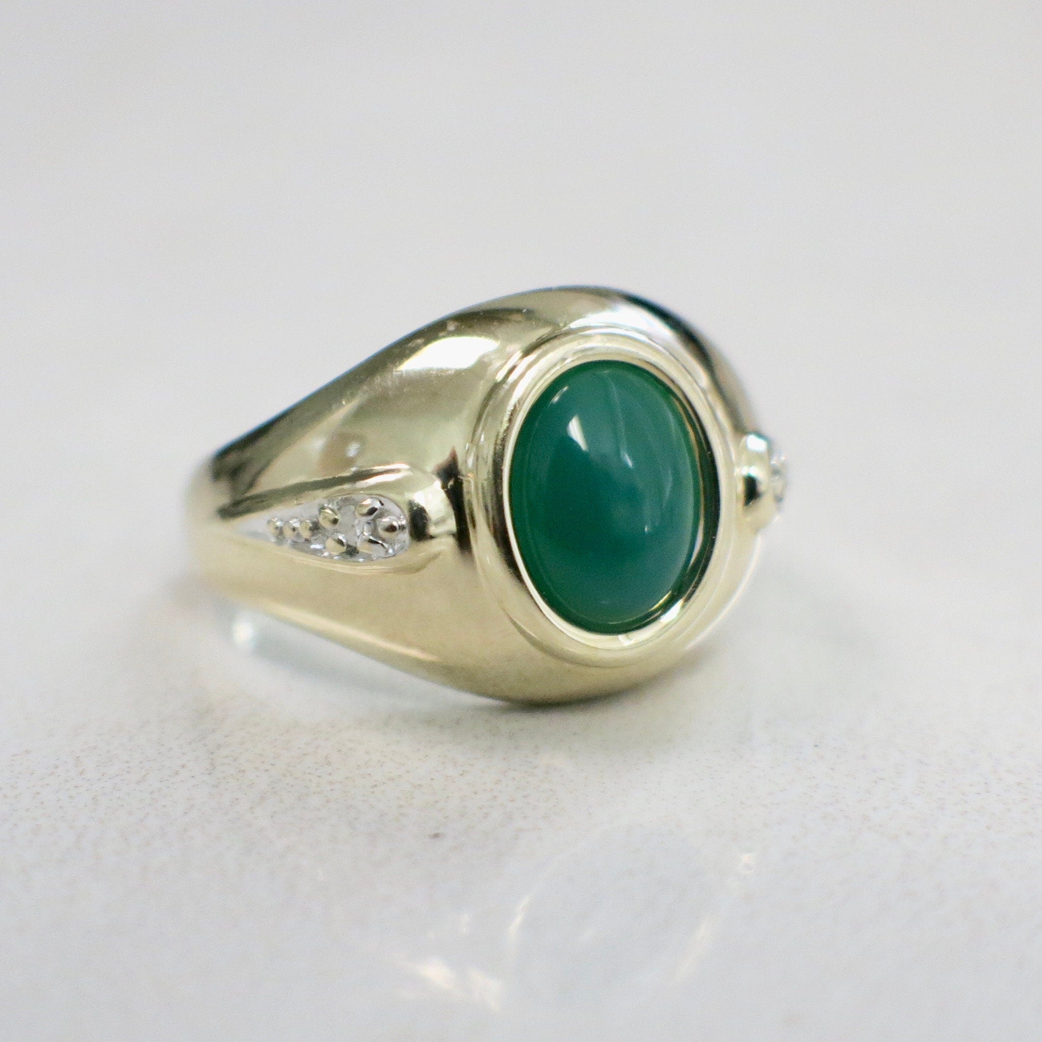 14K yellow gold chrysoprase cabochon ring with diamond accents, size 6, featuring a polished green gemstone and elegant gold setting.
