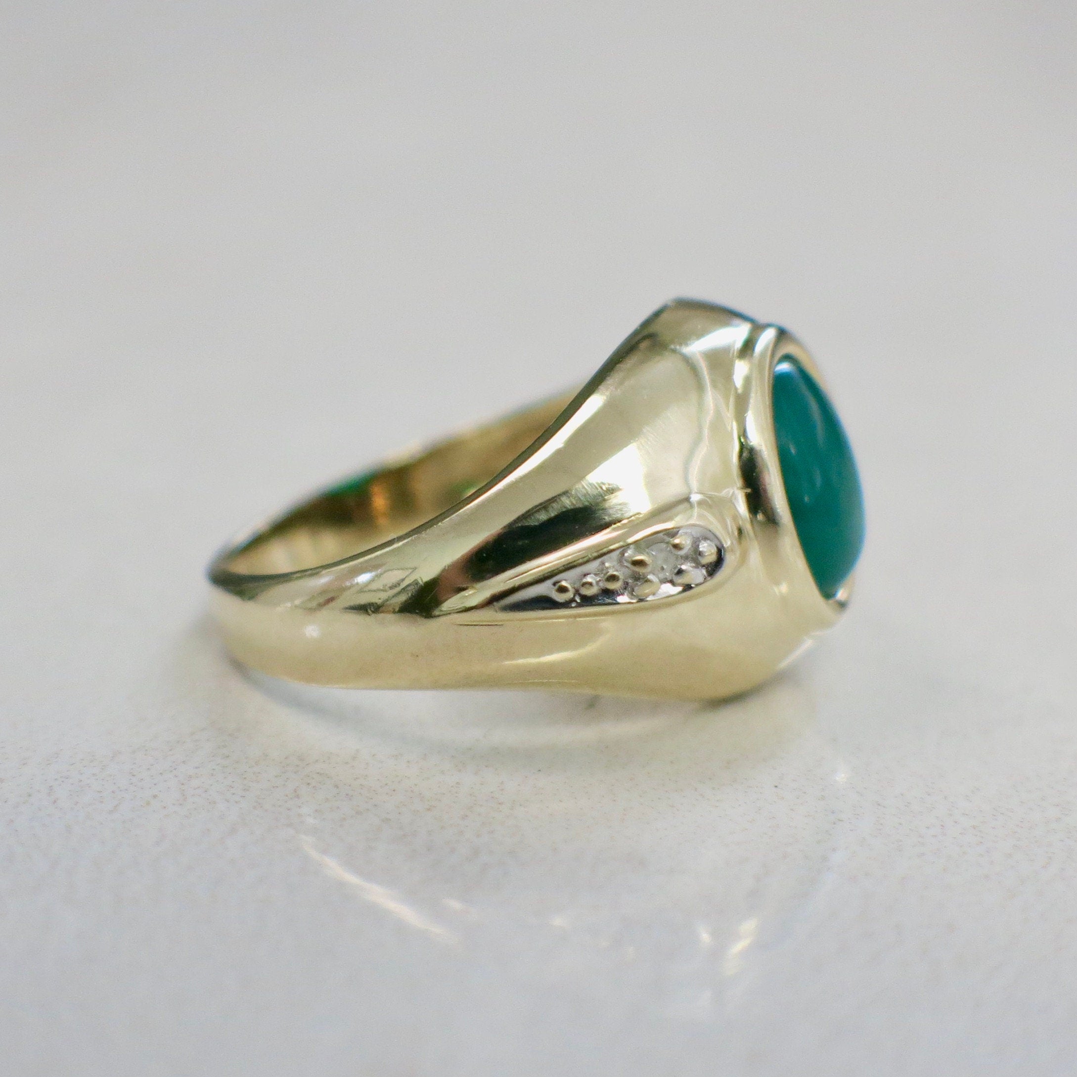 14K yellow gold chrysoprase cabochon ring with diamond accents, size 6, featuring a polished green gemstone and elegant gold band.