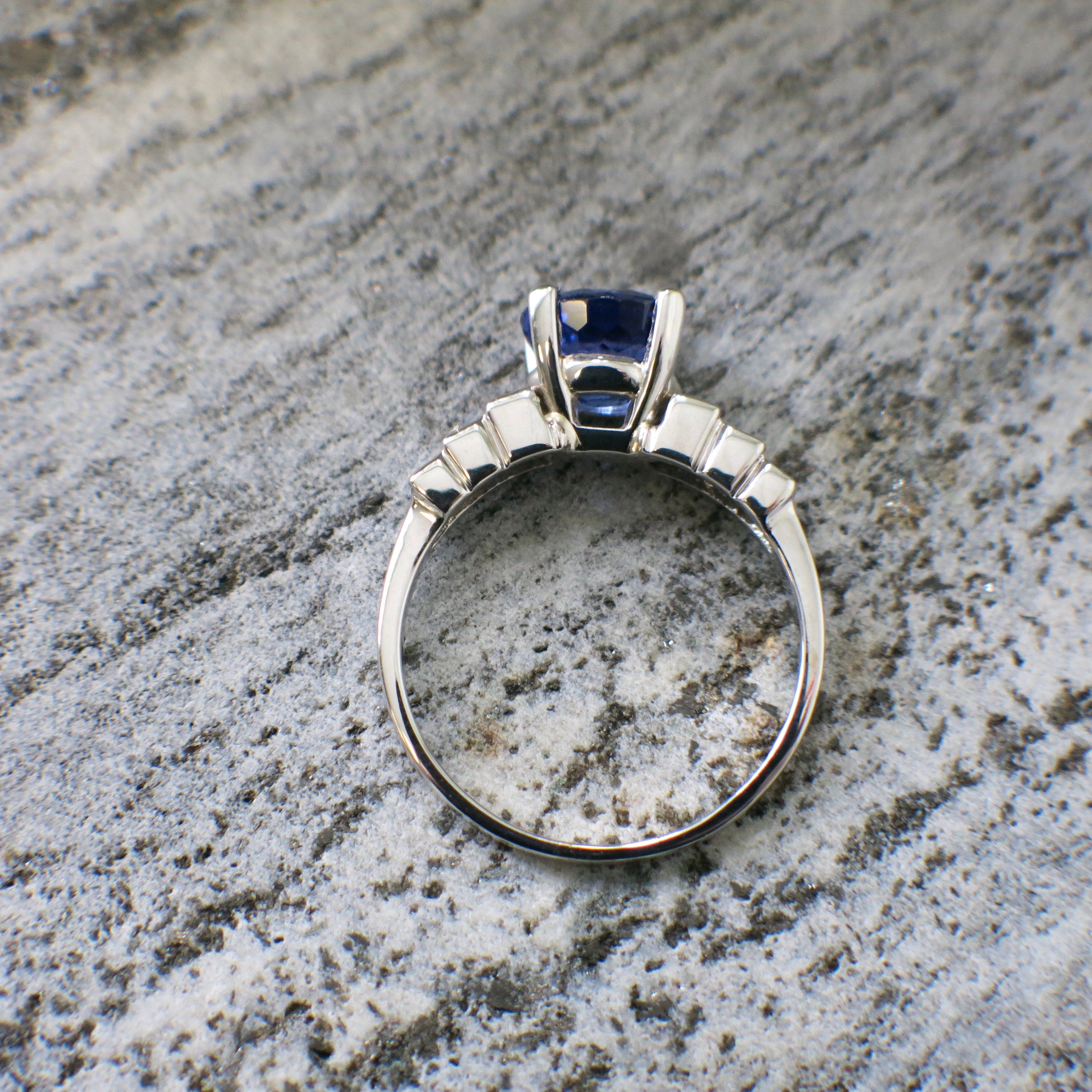 18K white gold oval tanzanite and diamond ring with east-to-west setting, size 8.5, by Black Market LLC.