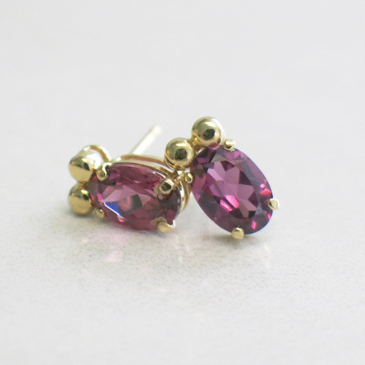 14K Yellow Gold Rhodolite Garnet Earrings | Oval Garnet Studs 7 x 5 mm - Black Market LLC