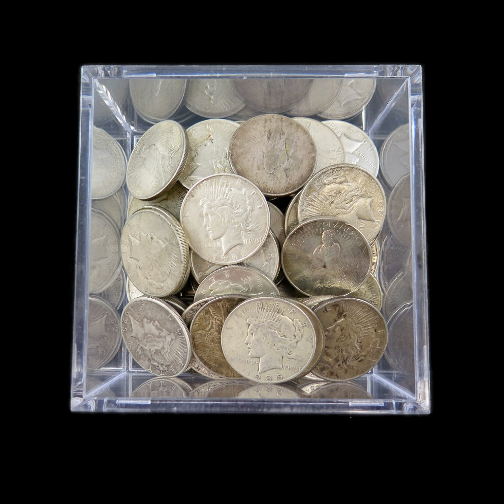 Circulated Peace Silver Dollar coin from 1921-1935, showcasing detailed design, silver finish, and vintage U.S. dollar coin features.