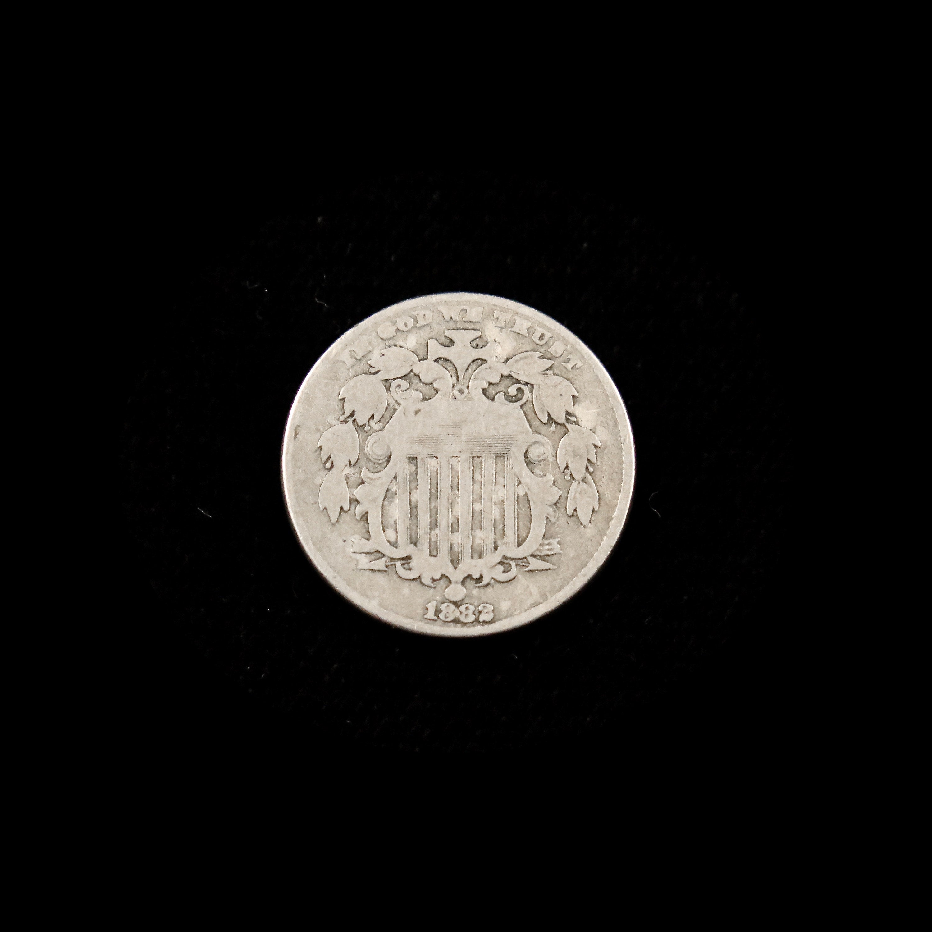 1882 Shield Nickel U.S. five-cent coin by Black Market LLC, showing the raw, circulated nickel with shield design and historical details.