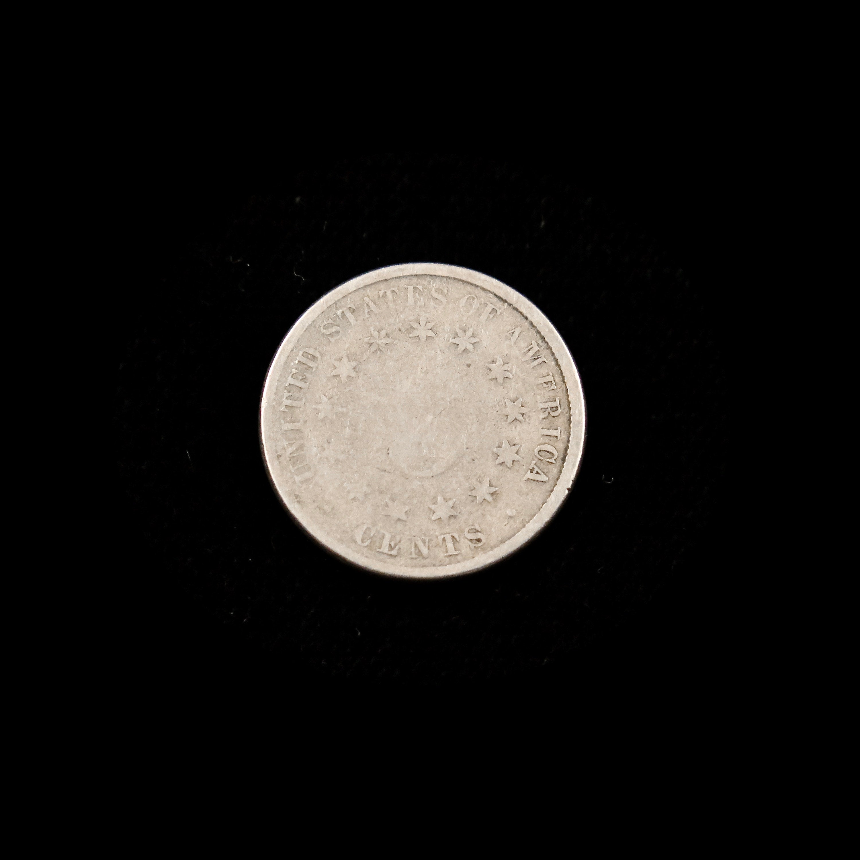 1882 Shield Nickel U.S. five-cent coin by Black Market LLC, showing the raw nickel coin with detailed shield design.
