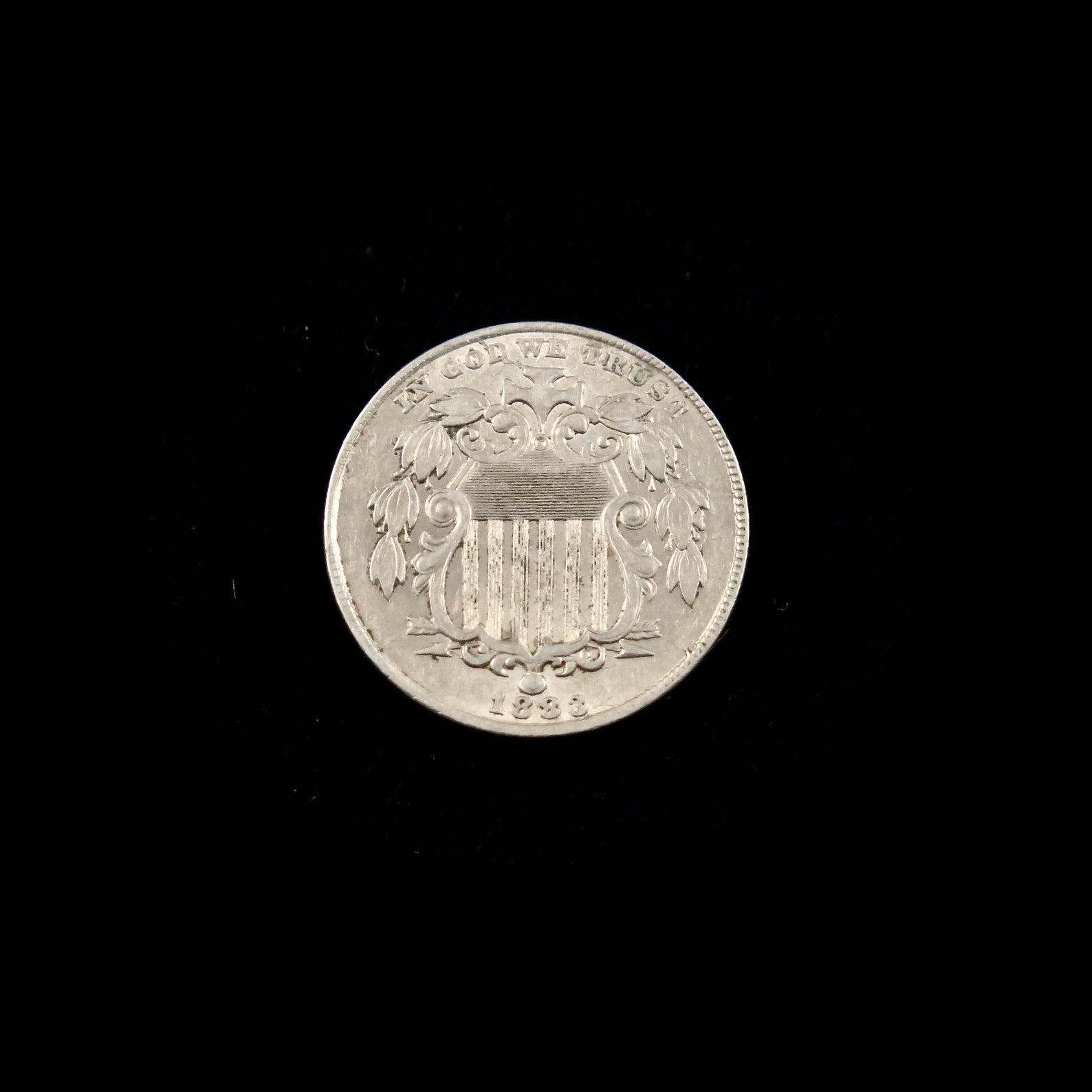 1883 Shield Nickel AU, final year of issue, raw U.S. five-cent coin featuring shield design and detailed surface from Black Market LLC