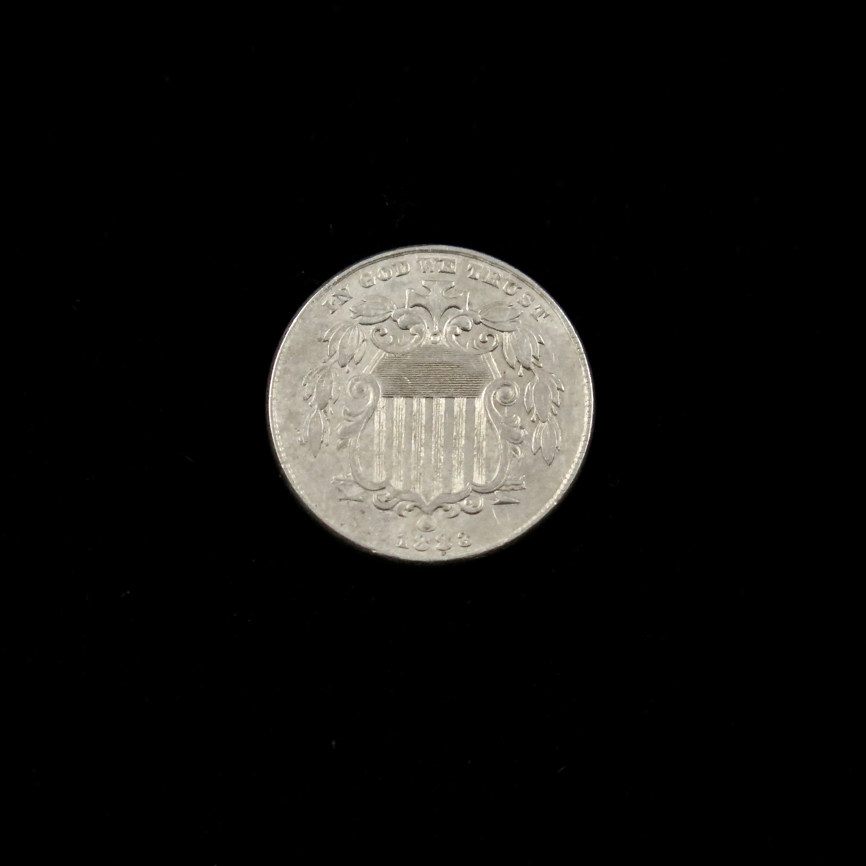 Circulated 1883 Shield Nickel, U.S. five-cent coin, final year of issue, raw condition, from Black Market LLC.
